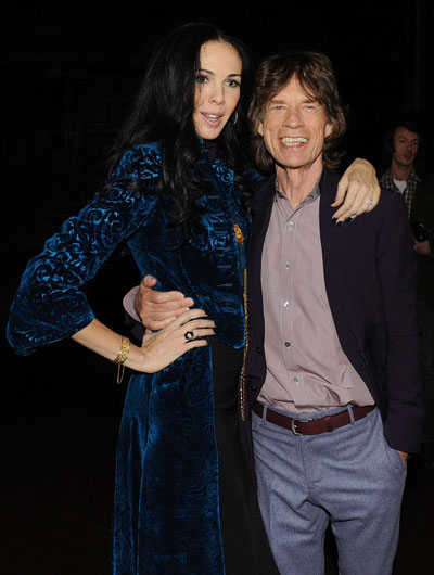 Mick Jagger and designer L'Wren Scott pose following her Fall/Winter 2012 collection during New York Fashion Week, February 16, 2012. 